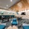 a room with a pool table and chairs